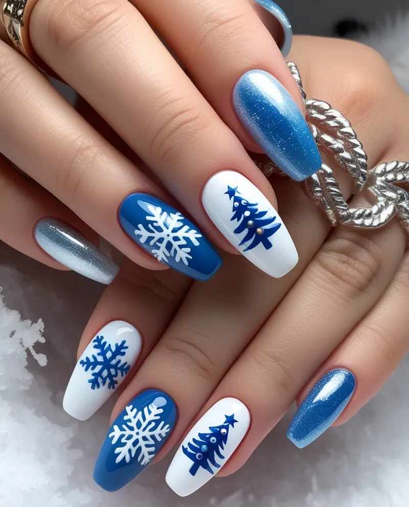 Winter-themed nails with snowflakes and icy blue polish.