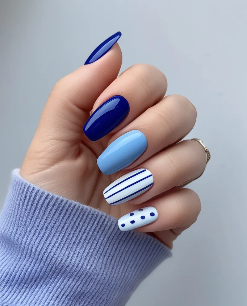 Simple Blue Nail Designs with solid blue or minimal patterns like dots.