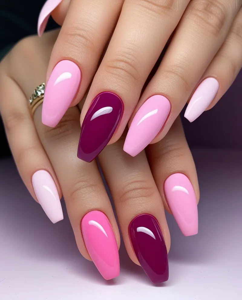 Gradient nails blending multiple pink tones for a smooth, elegant look.