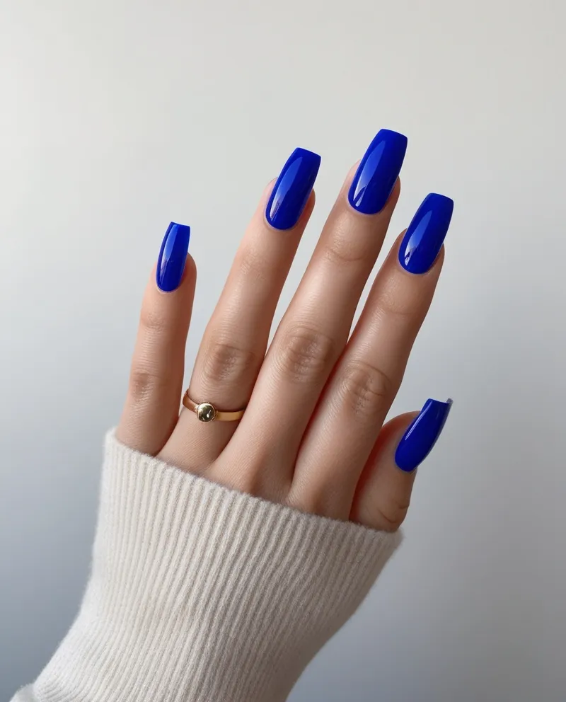 Blue French tip nails, a clean and stylish Blue Christmas Nails idea.