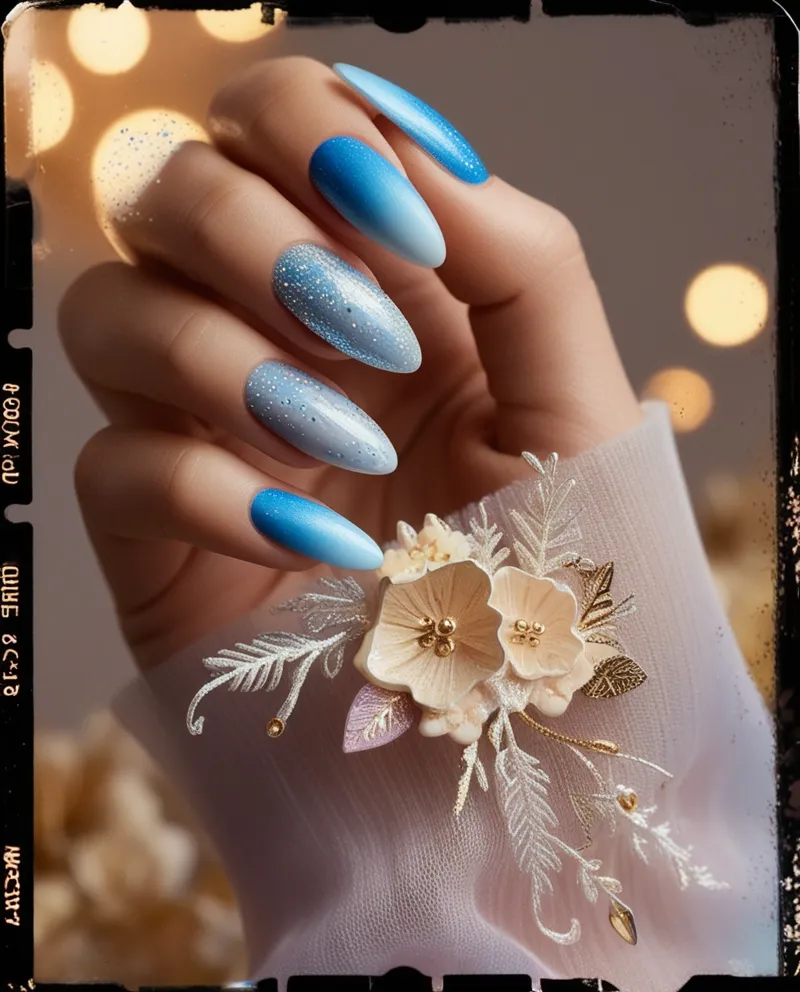 Almond-shaped Blue Nail Designs with glitter and floral patterns.