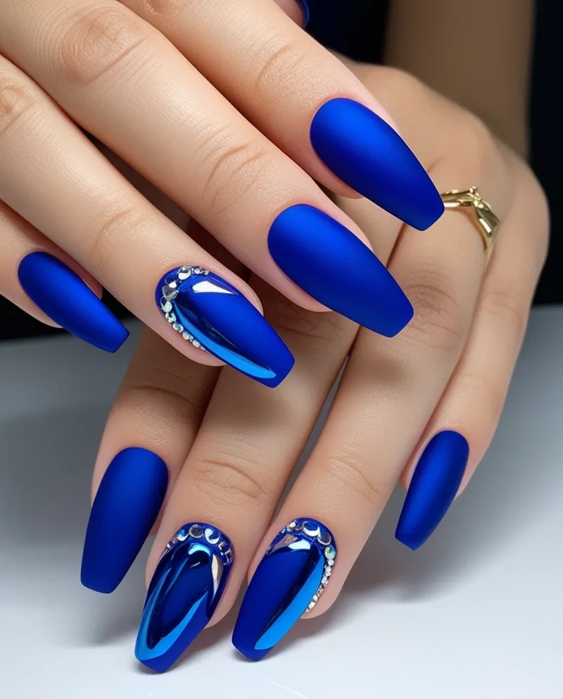 Matte blue nails with glossy accents, a trendy and unique Blue Christmas Nails idea.