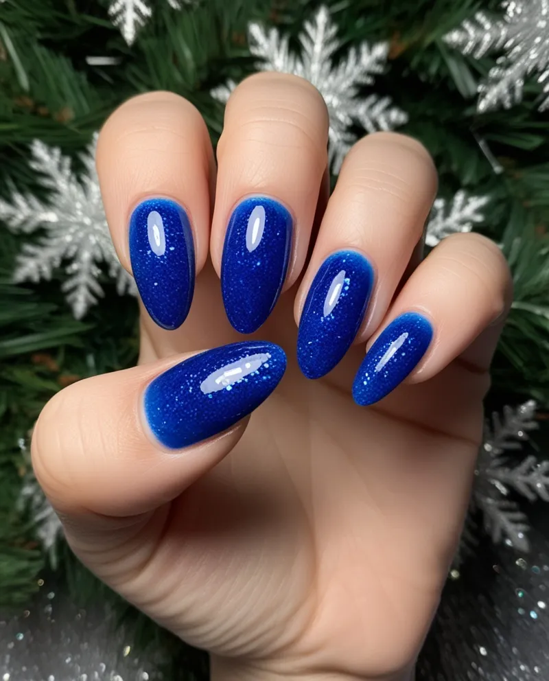 Glittery blue gradient nails, a frosty Blue Christmas Nails design.