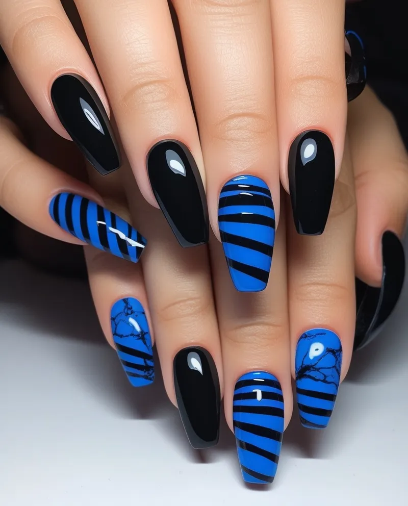 Bold Black and Blue Nail Designs with stripes and marble effects.