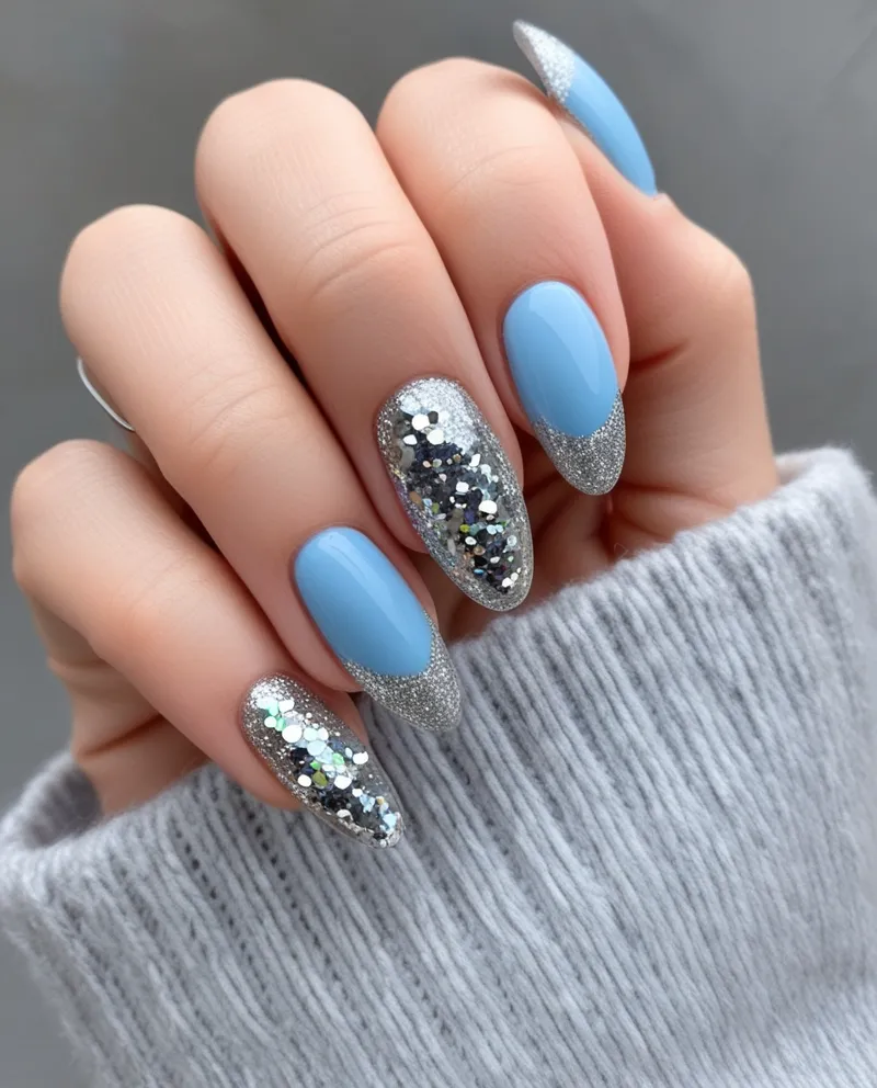 Light blue nails with silver glitter tips, a shiny and festive Blue Christmas Nails design.