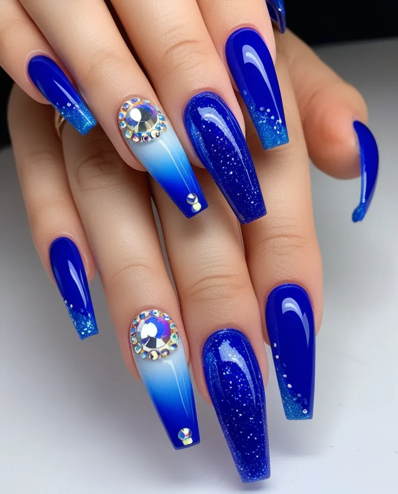 Acrylic Blue Nail Designs with glitter, ombré, and rhinestones.