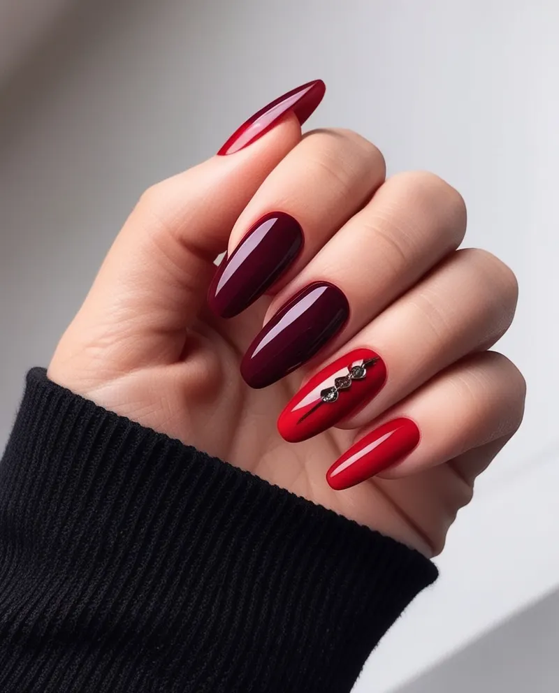 Bold red nails with a classic or dramatic design.