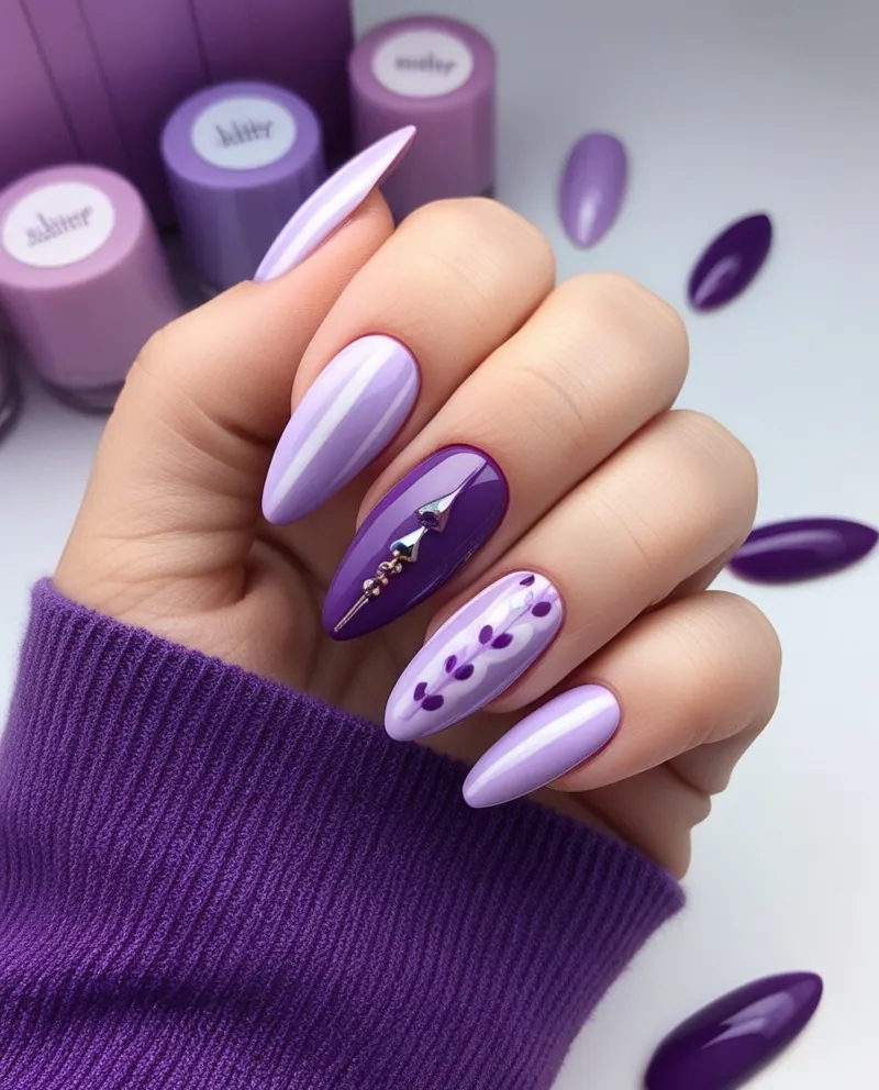 Stylish purple nails in lavender and deep plum hues with artistic designs.