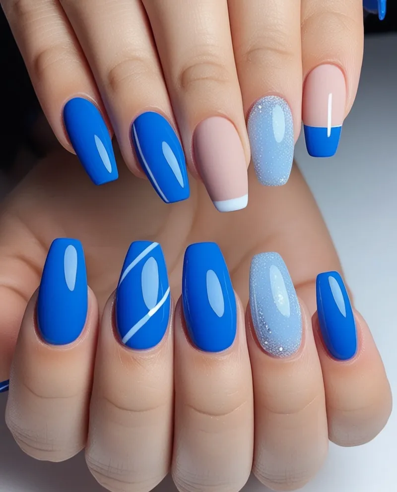 Short Blue Nail Designs with simple patterns like blue French tips and glitter.