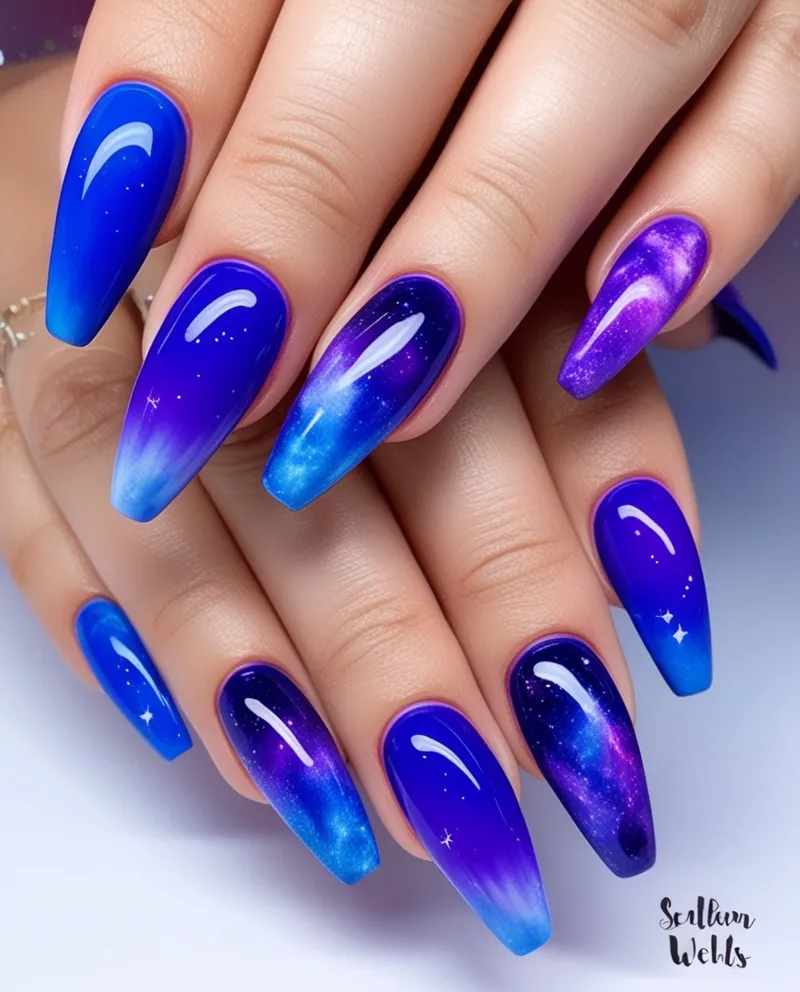 Vibrant Blue and Purple Nail Designs with ombré or galaxy patterns.