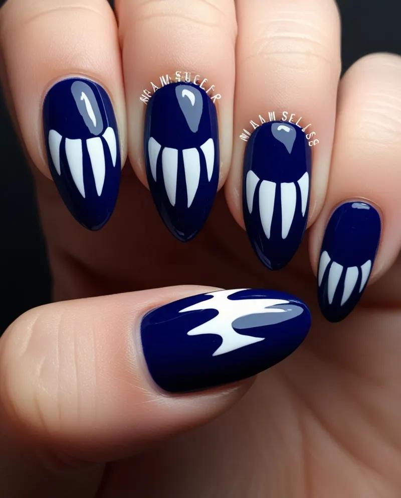 Blue nails with vampire fang patterns for a playful Valentine’s style.