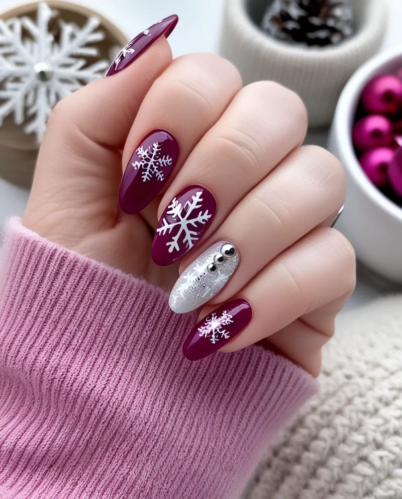 Stylish pink winter nails with seasonal designs and sparkle.