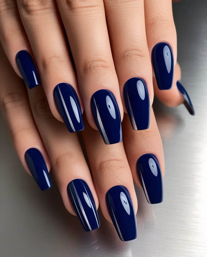 Dark blue nails with silver accents for a stylish Valentine’s style.