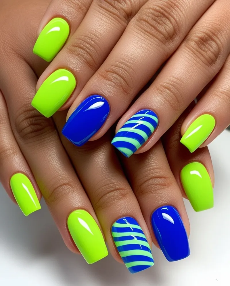 Bold Lime Green and Blue Nail Designs with stripes and abstract patterns.