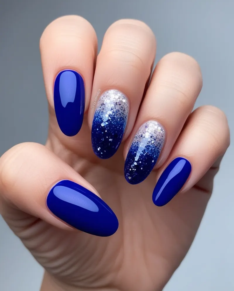 Blue nails with glitter gradient for a festive Valentine’s celebration.