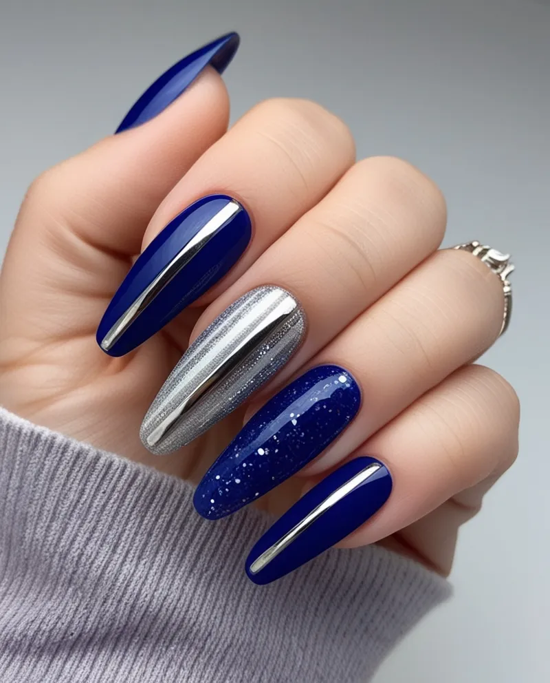 Elegant Blue and Silver Nail Designs with metallic accents and glitter.