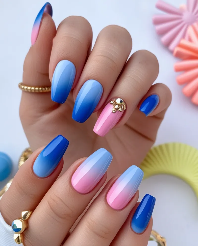 Bright blue and pink ombré nails for a cheerful summer style.