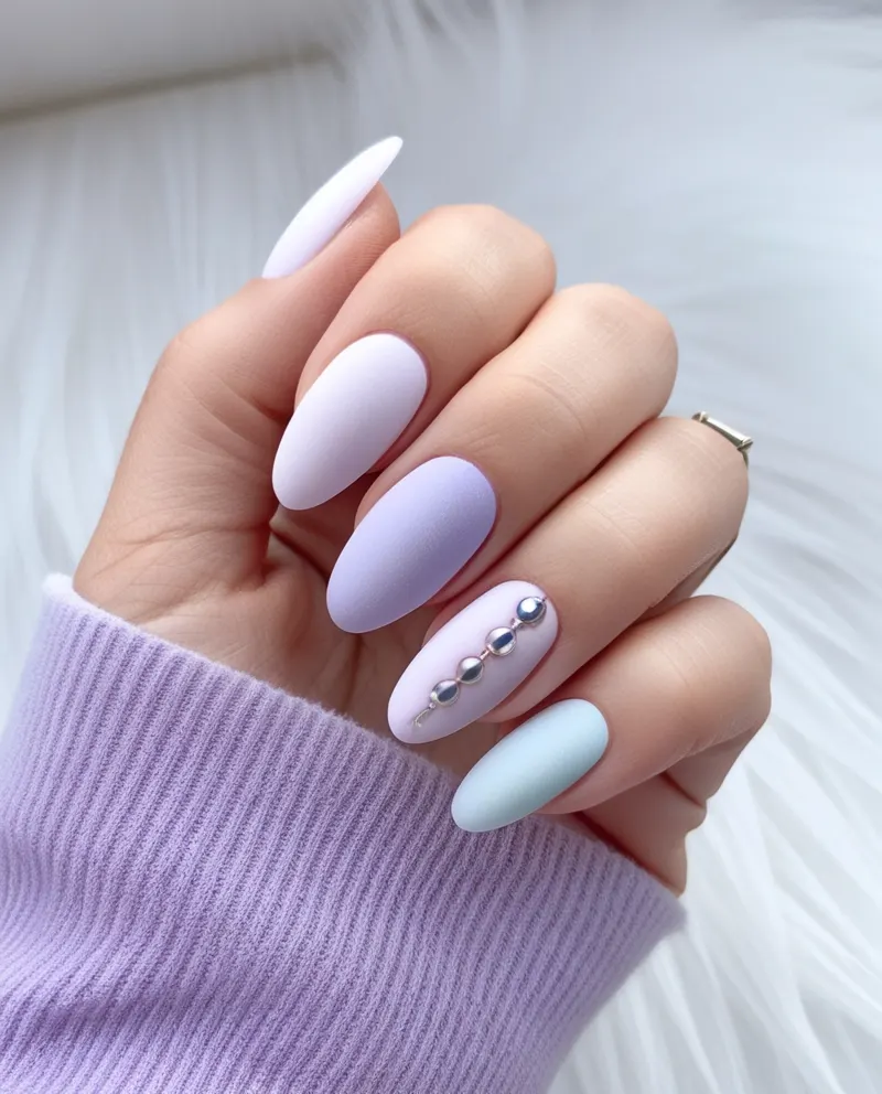 Frosted nails with pastel shades and a matte finish for a soft look.