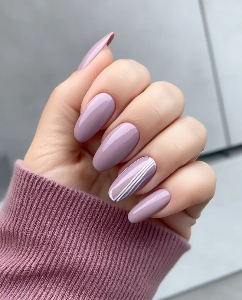 Dusty pink nails with minimalist designs for a subtle and chic look.